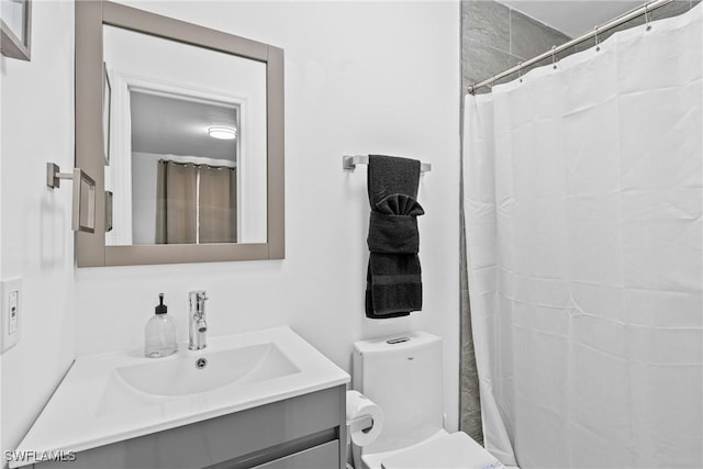 3303 6th St SW, Lehigh Acres, FL 33976 - bathroom featuring vanity, toilet, and a shower with curtain
