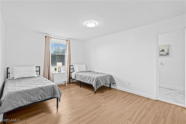 3303 6th St SW, Lehigh Acres, FL 33976 - bedroom with light wood finished floors and baseboards