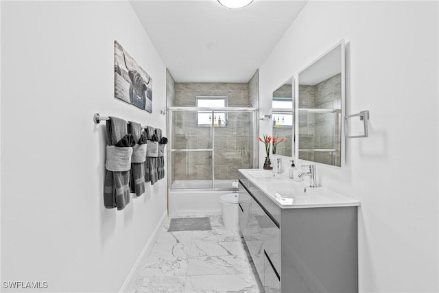 3303 6th St SW, Lehigh Acres, FL 33976 - bathroom with marble look tiles, toilet, bath / shower combo with glass door, vanity, and baseboards