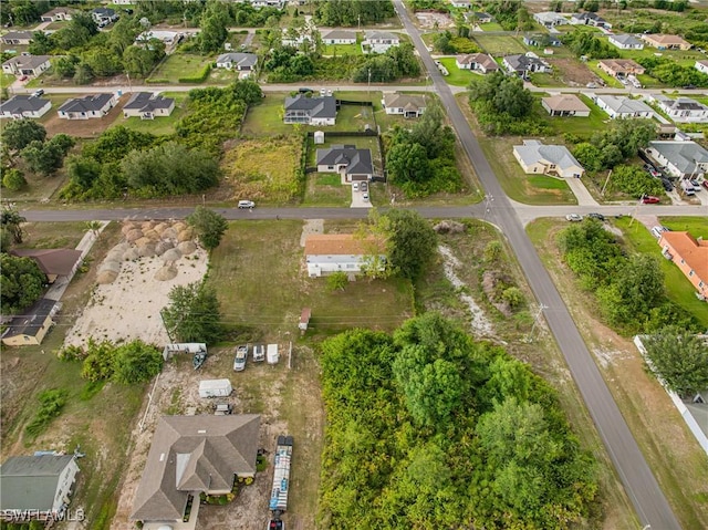3303 6th St SW, Lehigh Acres, FL 33976 - aerial view of property's location featuring nearby suburban area