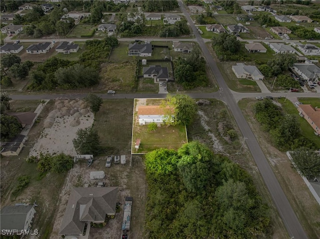 3303 6th St SW, Lehigh Acres, FL 33976 - aerial view of property and surrounding area with nearby suburban area