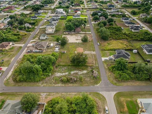 3303 6th St SW, Lehigh Acres, FL 33976 - aerial view of property and surrounding area with nearby suburban area