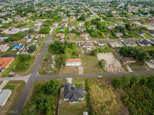 3303 6th St SW, Lehigh Acres, FL 33976 - aerial overview of property's location featuring nearby suburban area