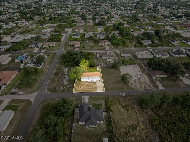 3303 6th St SW, Lehigh Acres, FL 33976 - aerial view of property's location with nearby suburban area