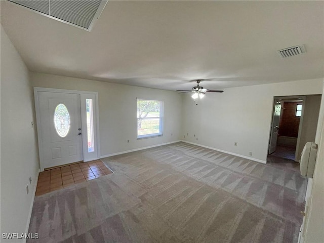 1706 Forest Lakes Blvd, Naples, FL 34105 - foyer with light colored carpet, baseboards, a ceiling fan, and light tile patterned floors