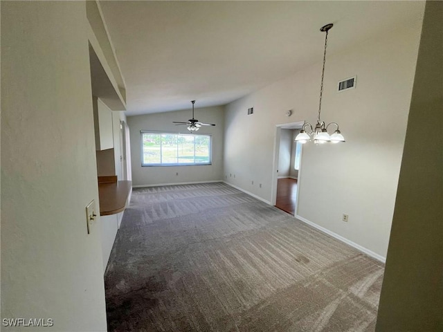 1706 Forest Lakes Blvd, Naples, FL 34105 - unfurnished living room featuring vaulted ceiling, carpet flooring, ceiling fan, baseboards, and a chandelier