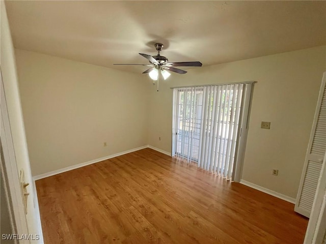 1706 Forest Lakes Blvd, Naples, FL 34105 - spare room featuring a ceiling fan, wood finished floors, and baseboards