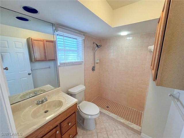 1706 Forest Lakes Blvd, Naples, FL 34105 - bathroom with toilet, tiled shower, vanity, and tile patterned floors