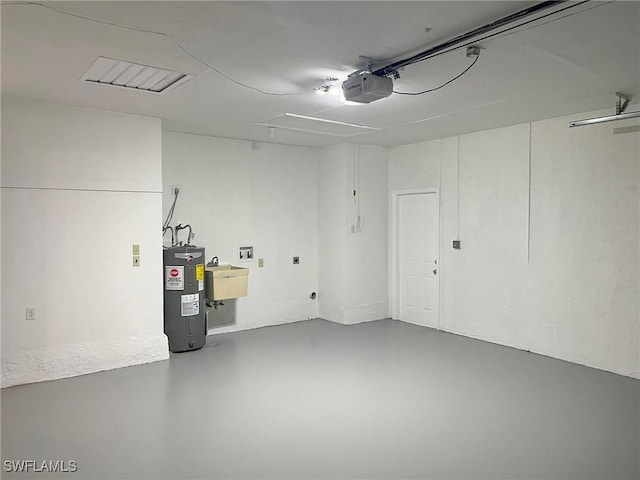 1706 Forest Lakes Blvd, Naples, FL 34105 - garage with electric water heater, a garage door opener, and a sink