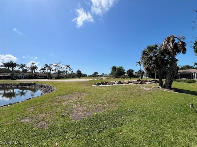 1706 Forest Lakes Blvd, Naples, FL 34105 - view of grassy yard featuring a water view