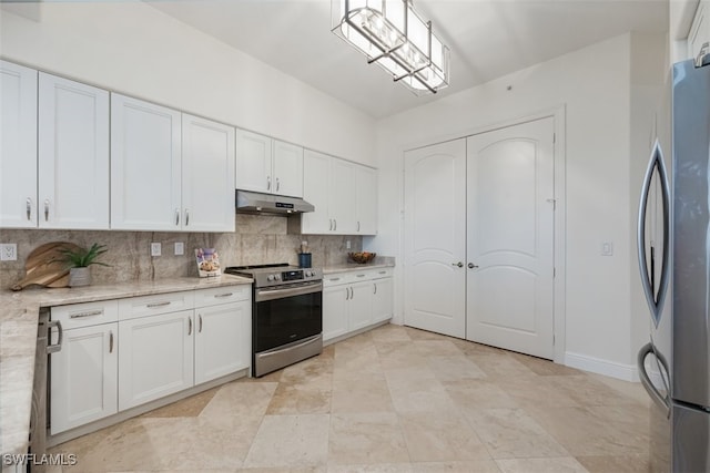 560 El Camino Real Unit 1304, Naples, FL 34119 - kitchen with appliances with stainless steel finishes, under cabinet range hood, decorative backsplash, white cabinetry, and light stone counters