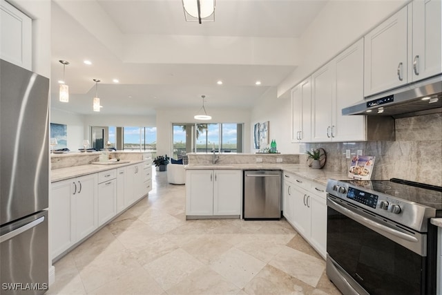 560 El Camino Real Unit 1304, Naples, FL 34119 - kitchen with stainless steel appliances, under cabinet range hood, a peninsula, tasteful backsplash, and recessed lighting