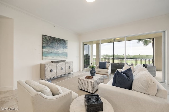 560 El Camino Real Unit 1304, Naples, FL 34119 - living room with ornamental molding, plenty of natural light, and baseboards