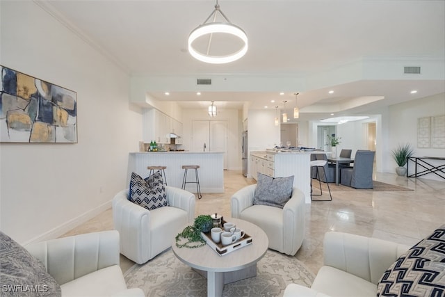 560 El Camino Real Unit 1304, Naples, FL 34119 - living area with crown molding, recessed lighting, and baseboards