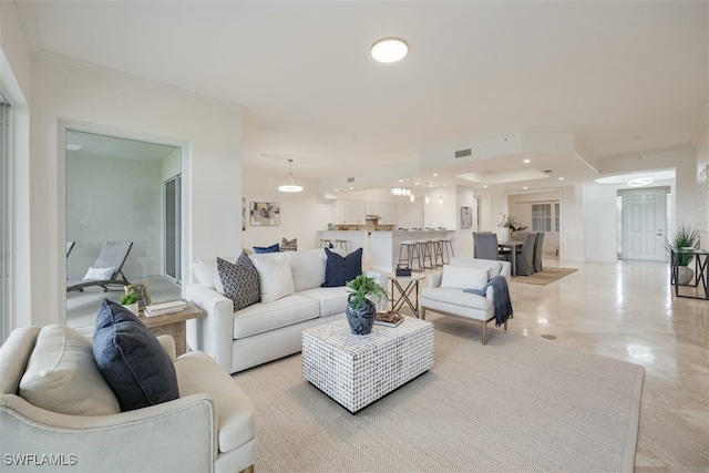 560 El Camino Real Unit 1304, Naples, FL 34119 - living area featuring crown molding