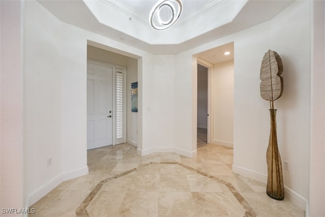 560 El Camino Real Unit 1304, Naples, FL 34119 - entrance foyer featuring baseboards, ornamental molding, recessed lighting, a tray ceiling, and a chandelier