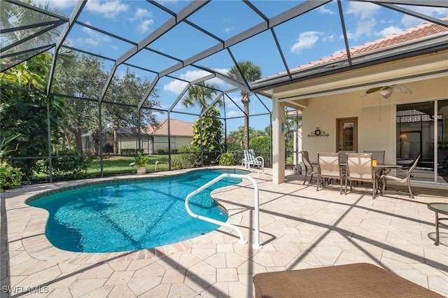 16121 Sand Ridge Ct, Fort Myers, FL 33908 - outdoor pool with a patio, glass enclosure, a ceiling fan, and outdoor dining space
