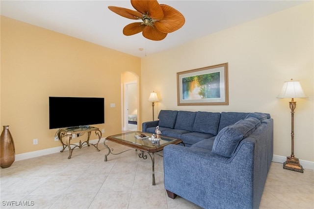 16121 Sand Ridge Ct, Fort Myers, FL 33908 - living area with arched walkways, light tile patterned flooring, ceiling fan, and baseboards