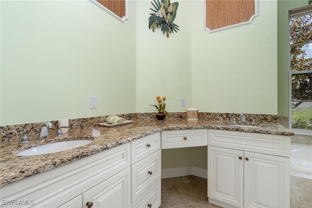 16121 Sand Ridge Ct, Fort Myers, FL 33908 - bathroom featuring double vanity, tile patterned flooring, and a bath