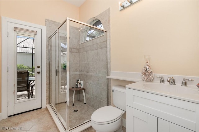 16121 Sand Ridge Ct, Fort Myers, FL 33908 - full bath with a shower stall, toilet, vanity, and tile patterned flooring
