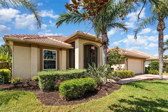16121 Sand Ridge Ct, Fort Myers, FL 33908 - mediterranean / spanish-style home with stucco siding, a garage, driveway, a front lawn, and a tiled roof