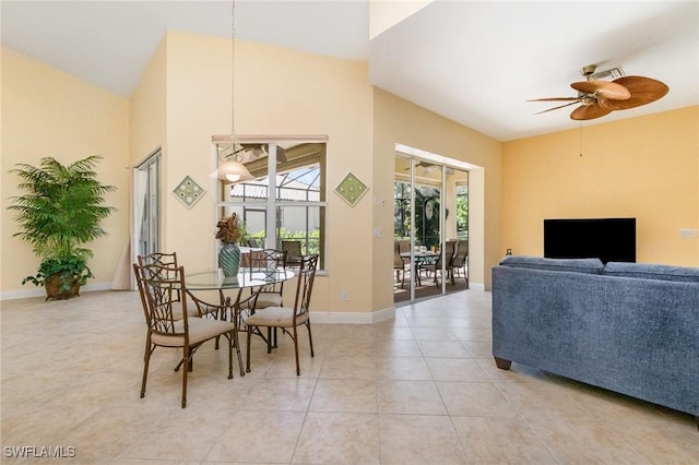 16121 Sand Ridge Ct, Fort Myers, FL 33908 - dining room featuring ceiling fan, light tile patterned floors, baseboards, and high vaulted ceiling