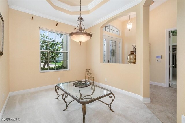 16121 Sand Ridge Ct, Fort Myers, FL 33908 - sitting room with arched walkways, ornamental molding, a tray ceiling, carpet floors, and baseboards