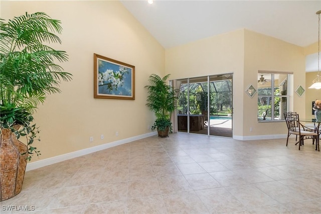 16121 Sand Ridge Ct, Fort Myers, FL 33908 - spare room featuring high vaulted ceiling, light tile patterned floors, and baseboards