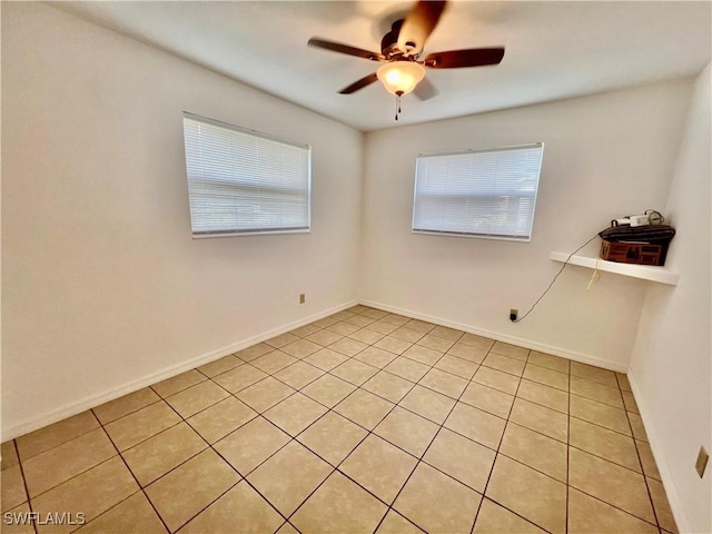 118 Alcala Ave, Lehigh Acres, FL 33936 - spare room featuring plenty of natural light, light tile patterned floors, ceiling fan, and baseboards