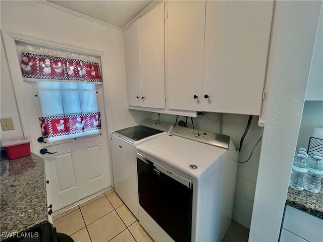 118 Alcala Ave, Lehigh Acres, FL 33936 - washroom featuring cabinet space, washer and dryer, ornamental molding, and light tile patterned floors