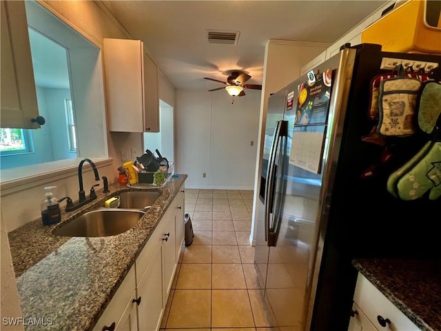 118 Alcala Ave, Lehigh Acres, FL 33936 - kitchen featuring a sink, stainless steel refrigerator with ice dispenser, ceiling fan, white cabinetry, and light tile patterned floors