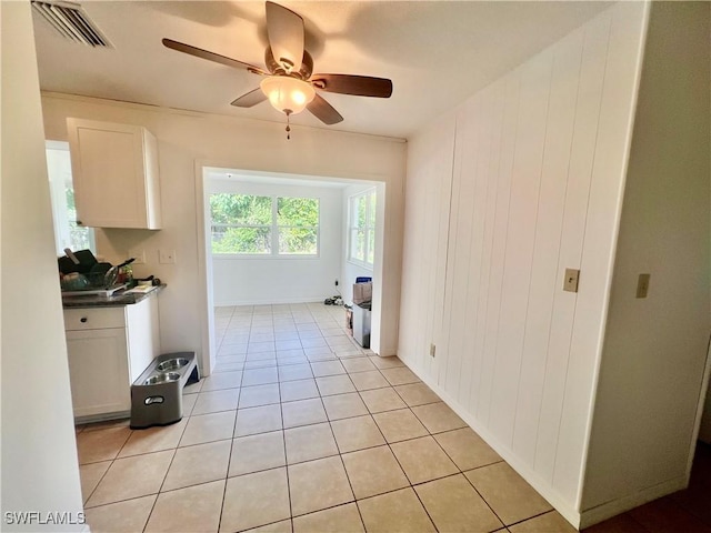 118 Alcala Ave, Lehigh Acres, FL 33936 - laundry area with ceiling fan and light tile patterned floors