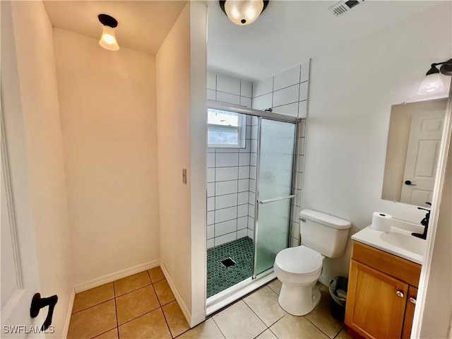118 Alcala Ave, Lehigh Acres, FL 33936 - bathroom featuring vanity, toilet, a shower stall, tile patterned floors, and baseboards