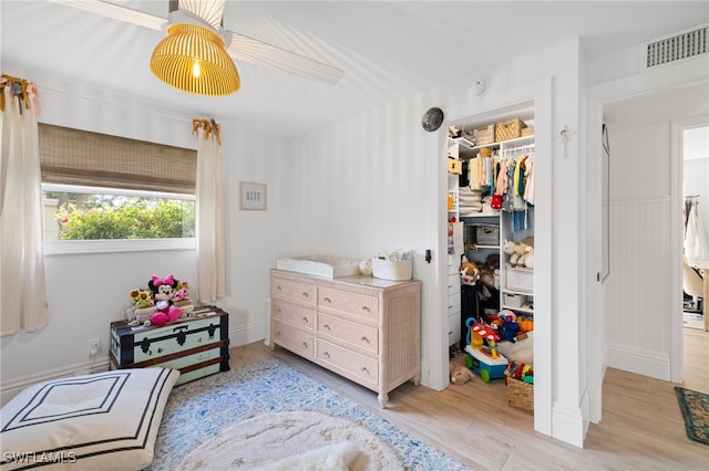 1549 Sandpiper St Unit 39, Naples, FL 34102 - bedroom with light wood finished floors, a closet, ceiling fan, and a spacious closet