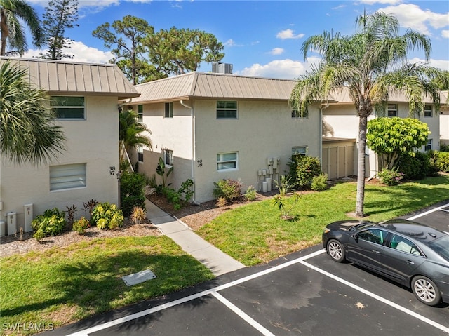1549 Sandpiper St Unit 39, Naples, FL 34102 - view of building exterior with uncovered parking