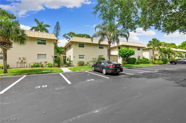 1549 Sandpiper St Unit 39, Naples, FL 34102 - view of uncovered parking lot