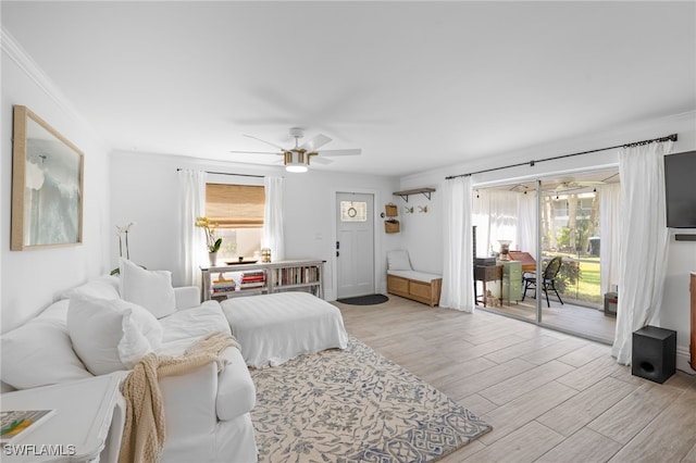 1549 Sandpiper St Unit 39, Naples, FL 34102 - bedroom featuring access to outside, light wood-type flooring, a ceiling fan, and ornamental molding