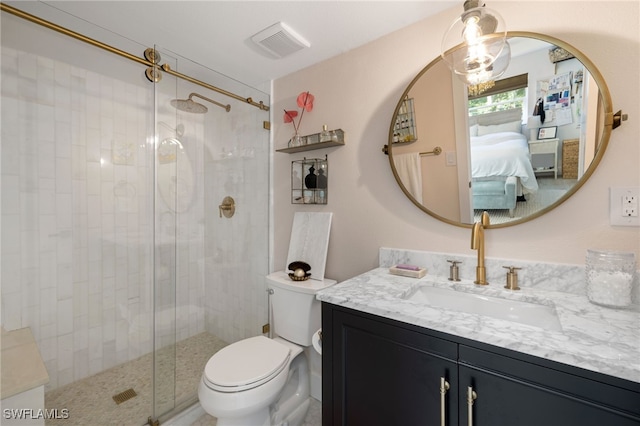 1549 Sandpiper St Unit 39, Naples, FL 34102 - ensuite bathroom featuring vanity, a stall shower, and toilet