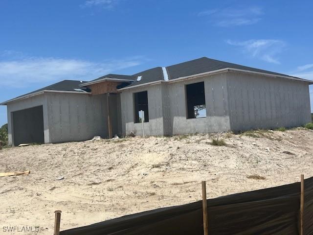 861 Newell St E, Lehigh Acres, FL 33974 - view of front of house