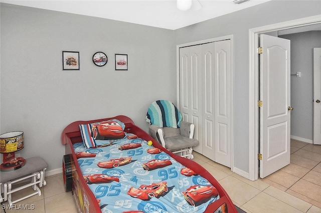 3408 26th St SW, Lehigh Acres, FL 33976 - bedroom with light tile patterned flooring, a closet, and baseboards