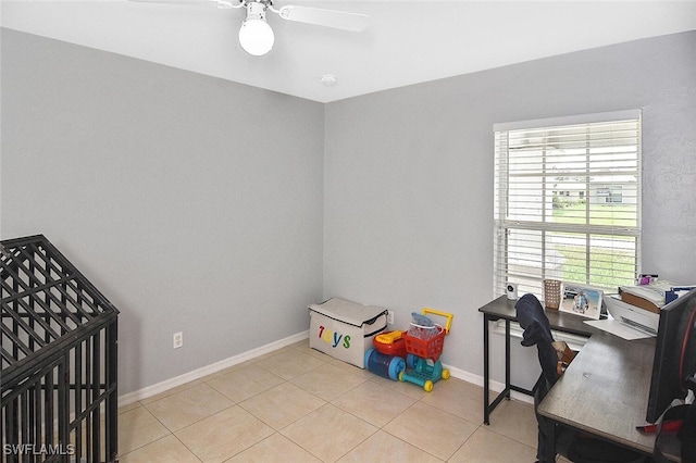 3408 26th St SW, Lehigh Acres, FL 33976 - home office with a ceiling fan, light tile patterned floors, and baseboards