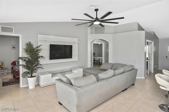 3408 26th St SW, Lehigh Acres, FL 33976 - living room featuring a ceiling fan, arched walkways, light tile patterned floors, and high vaulted ceiling