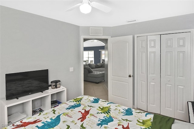 3408 26th St SW, Lehigh Acres, FL 33976 - bedroom featuring a closet, a ceiling fan, and tile patterned floors