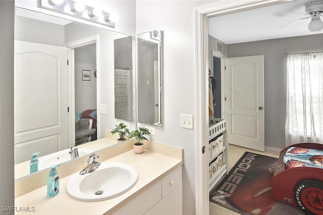 3408 26th St SW, Lehigh Acres, FL 33976 - bathroom with vanity, tile patterned flooring, and ceiling fan