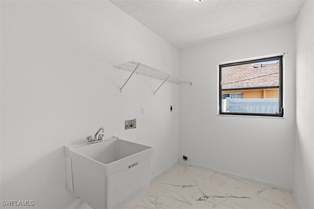 1306 SW 10th Pl, Cape Coral, FL 33991 - laundry room with electric dryer hookup, light marble finish floors, hookup for a washing machine, a textured ceiling, and baseboards