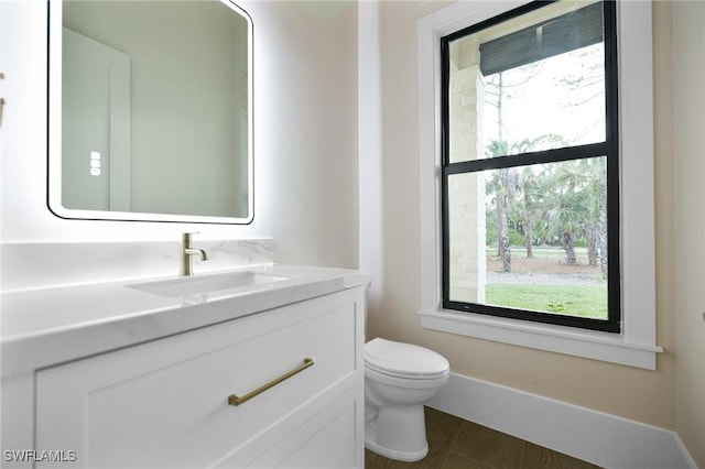 524 13th St SW, Naples, FL 34117 - bathroom featuring toilet, vanity, and tile patterned floors