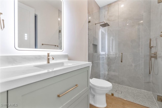 524 13th St SW, Naples, FL 34117 - bathroom featuring vanity, a marble finish shower, and toilet