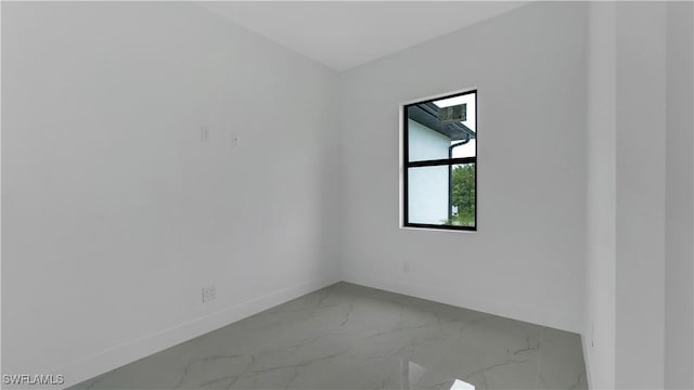 3315 Sunshine Blvd N, Lehigh Acres, FL 33971 - spare room featuring baseboards and marble finish floors