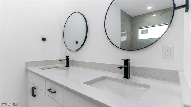 3315 Sunshine Blvd N, Lehigh Acres, FL 33971 - bathroom featuring double vanity and recessed lighting