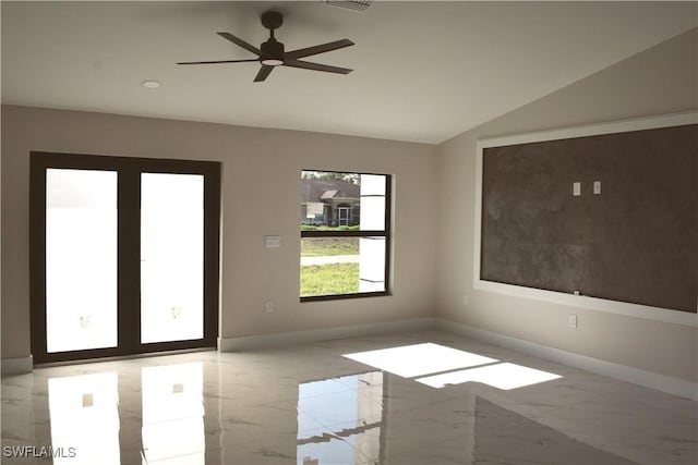 1013 Agnes Ave, Lehigh Acres, FL 33971 - empty room featuring marble tiled flooring, baseboards, vaulted ceiling, and a ceiling fan